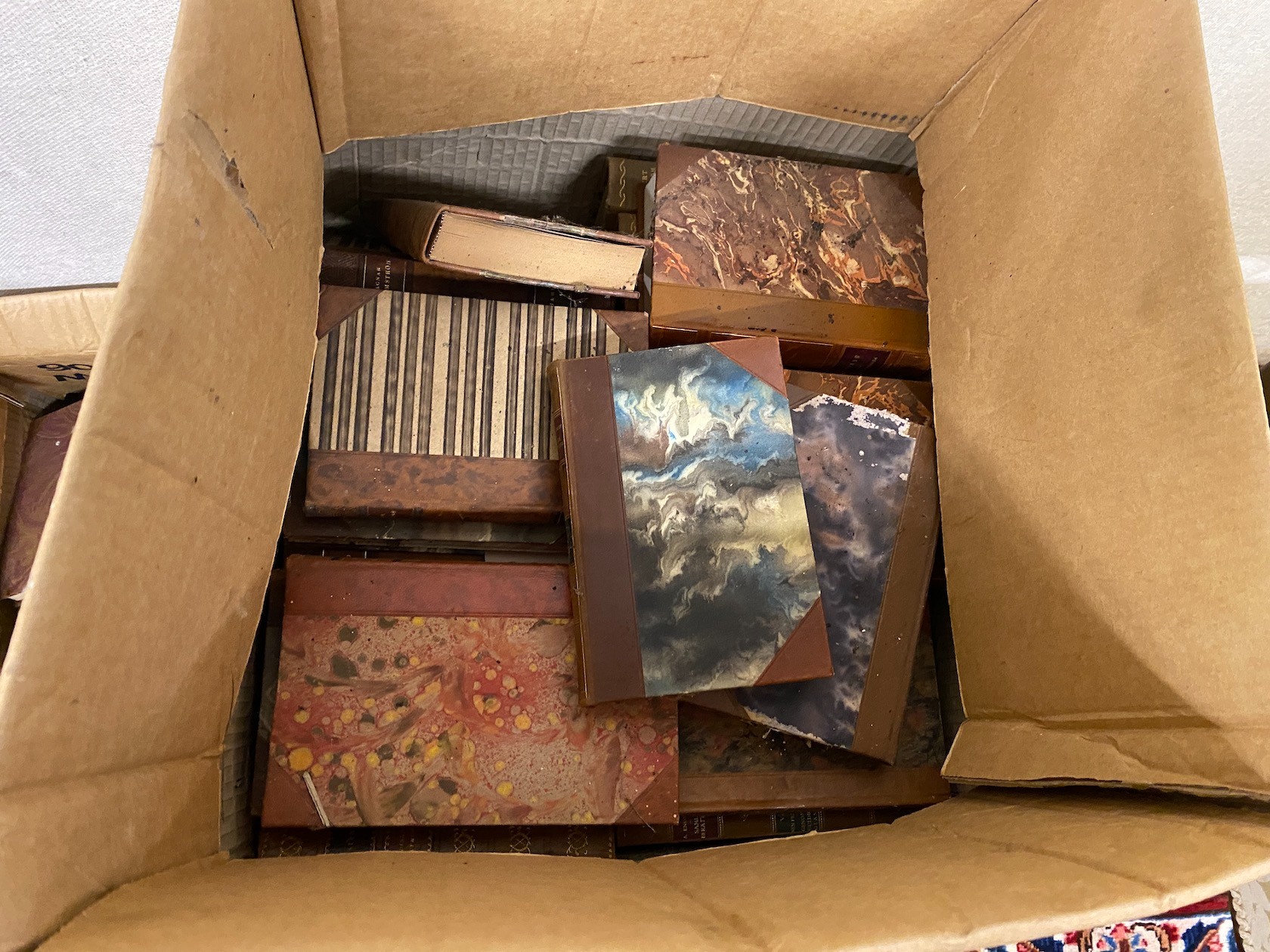 A quantity of assorted leather bindings